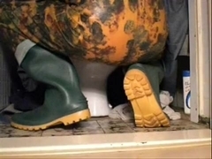 nlboots - green boots and camo overalls on toilet