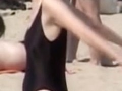 Amateur in black swimsuit on the candid beach voyeur video 07z