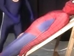 Superhero attired studs sucking cock