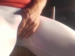 Man showing ass and teasing cock in white leggings