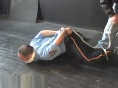 BG Cop handcuffed gagged and hogtied.