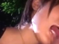 japanese beauty blowing a boy-friend in the park
