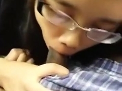 Nerdy asian girl with glasses sucks her black bf's cock in the car on a parking lot