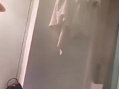 Girl is taking her clothes off in a change room