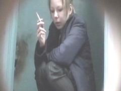 Amateur shots of smoking ladies on their hunkers taking a leak