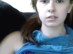 Cute brunette girl plays with her small tits and shaved pussy on the sofa