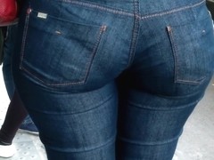 Brunette babe on the street in huge ass tight jeans video