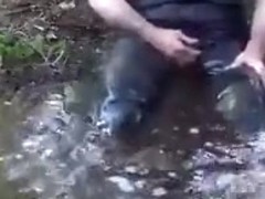 Pissing and bathing in slimy water clothed jeans and leather
