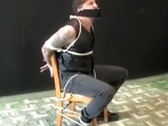 BG Beefy stud in leather vest tied to chair and gagged