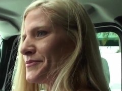 Mature blondie sucks throbbing penis in a car