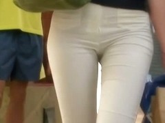 Hot tight and white pants girl in a supermarket voyeur video