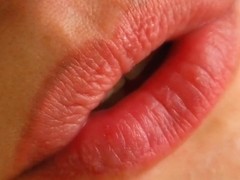 A cute brunette oils up and spreads her pink pussy lips.