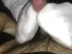 Teasing socked footjob