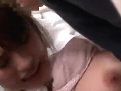 She takes out her breasts and has them massaged, then takes out her penis and rubs it against them.