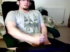 Seductive homosexual is jerking off in his room and filming himself on computer webcam