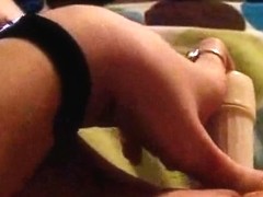 Young babe films herself masturbating with a small toy