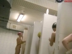 Several tall swimmers being nude in a voyeur bath cam video