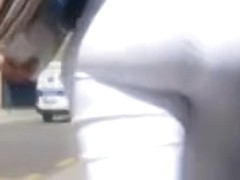 Big fat ass in white pants gets filmed by a voyeur's cam