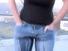 Girlfriend on a walking bridge pisses her jeans