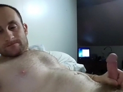 Attractive dude is having a good time in his room and filming himself on web cam