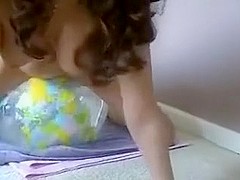 naked girl riding transparent earth beachball