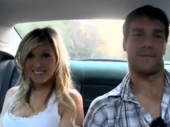 Cute blondie starts giving a head in a car