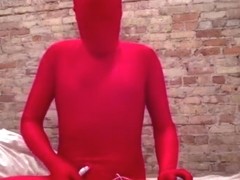 Zentai play in red with vibrator
