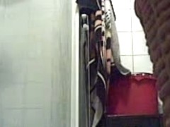 Bathroom spy cam records a blonde pissing and then showering