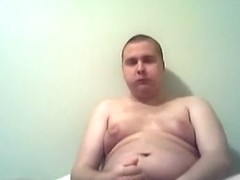 obese boy eating a box of fudge brownies