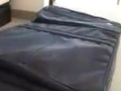 Girl gets loaded in suitcase and then banged