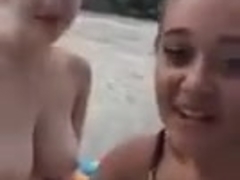 two friends sitting naked outside