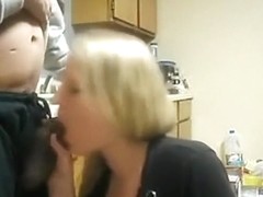 Blonde white girl sucks her black bf's cock in the kitchen