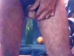 Long green bottle into rectum with urethral beads