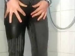 peeing four times in gray skinny jeans