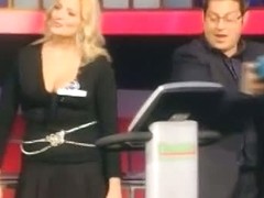 Blonde woman with big juggs gives the audience an eyeful of her melons and ass
