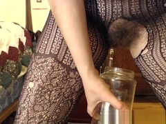 My hairy pussy pissing through fishnets