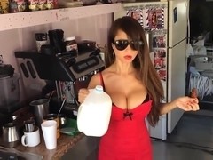 Hot Asian Babe with huge boobs eating hot chilli peppers.